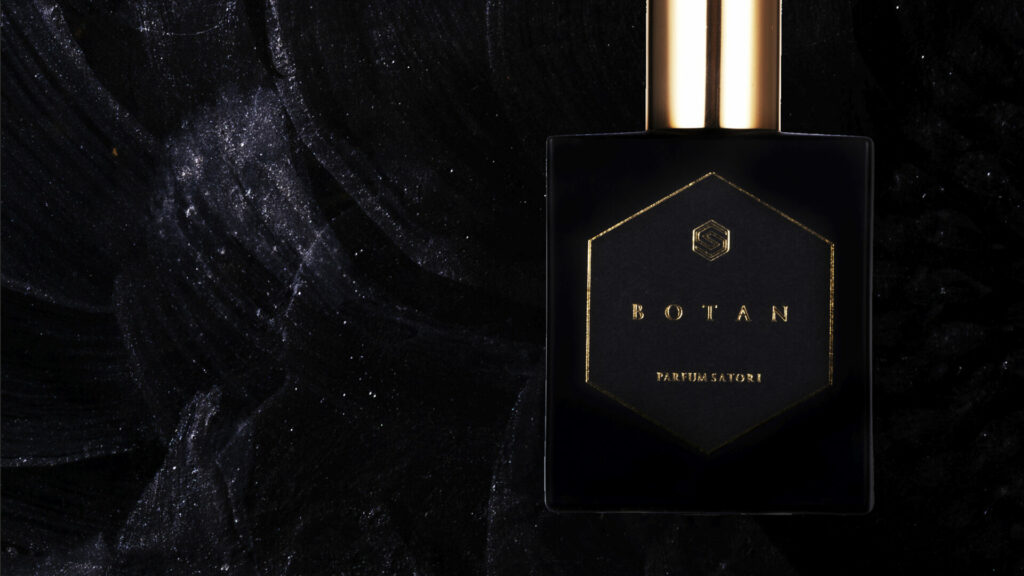 BOTAN bottle glowing in darkness, leaving a trace of silent resonance.